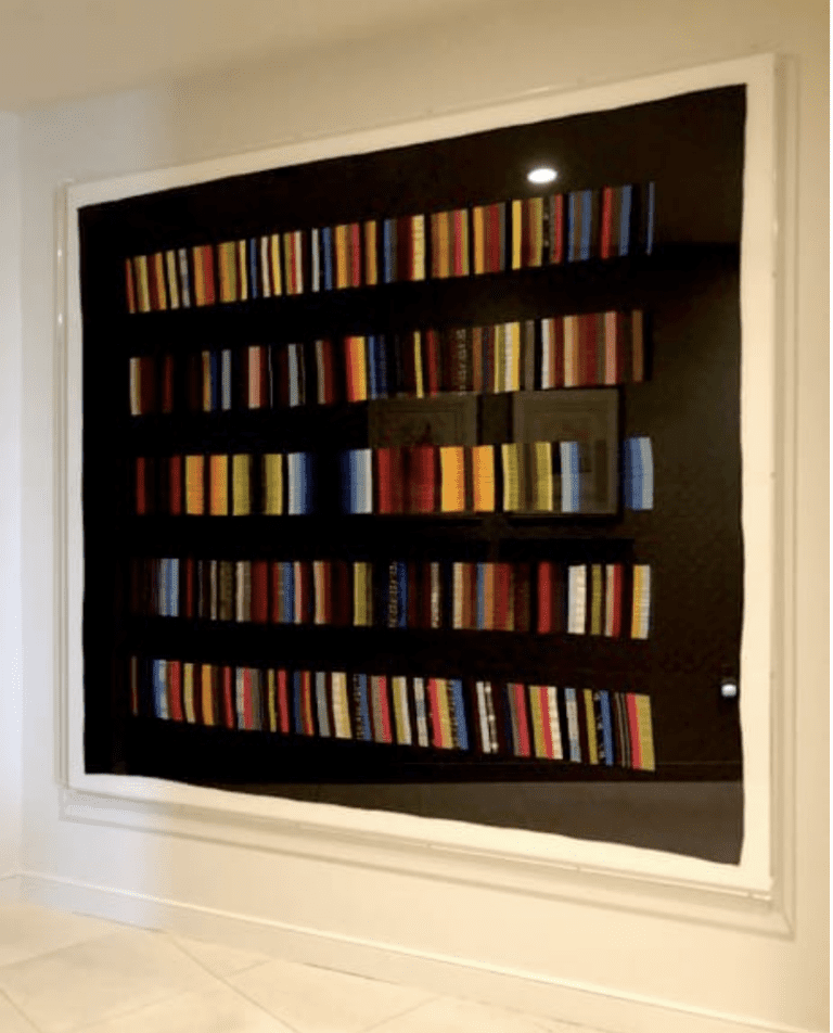Schallenberg quilt displaying hundreds of narrow fabric strips organized in horizontal bands within a framed display.